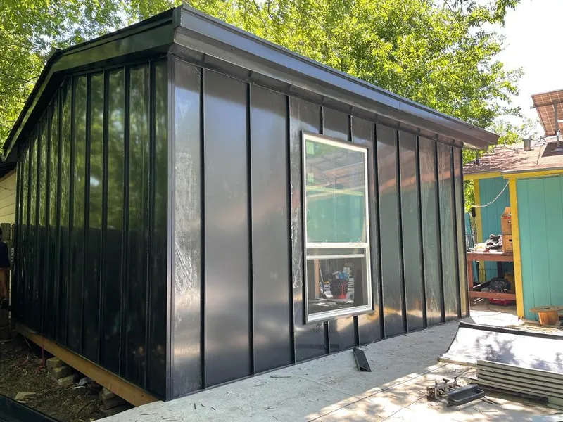 Black standing seam metal wall panels for Metal Roof Installation in St. Francis