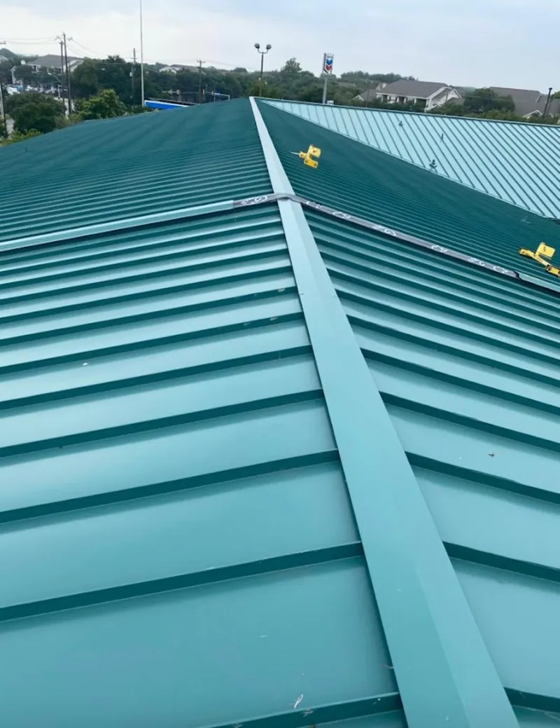 Green commercial metal roof ridge and valley for Metal Roof Repair in St. Francis
