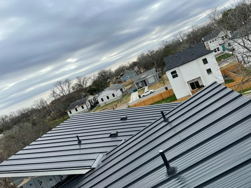 Standing seam metal roof panels with vents for Skylight Repair in St. Francis